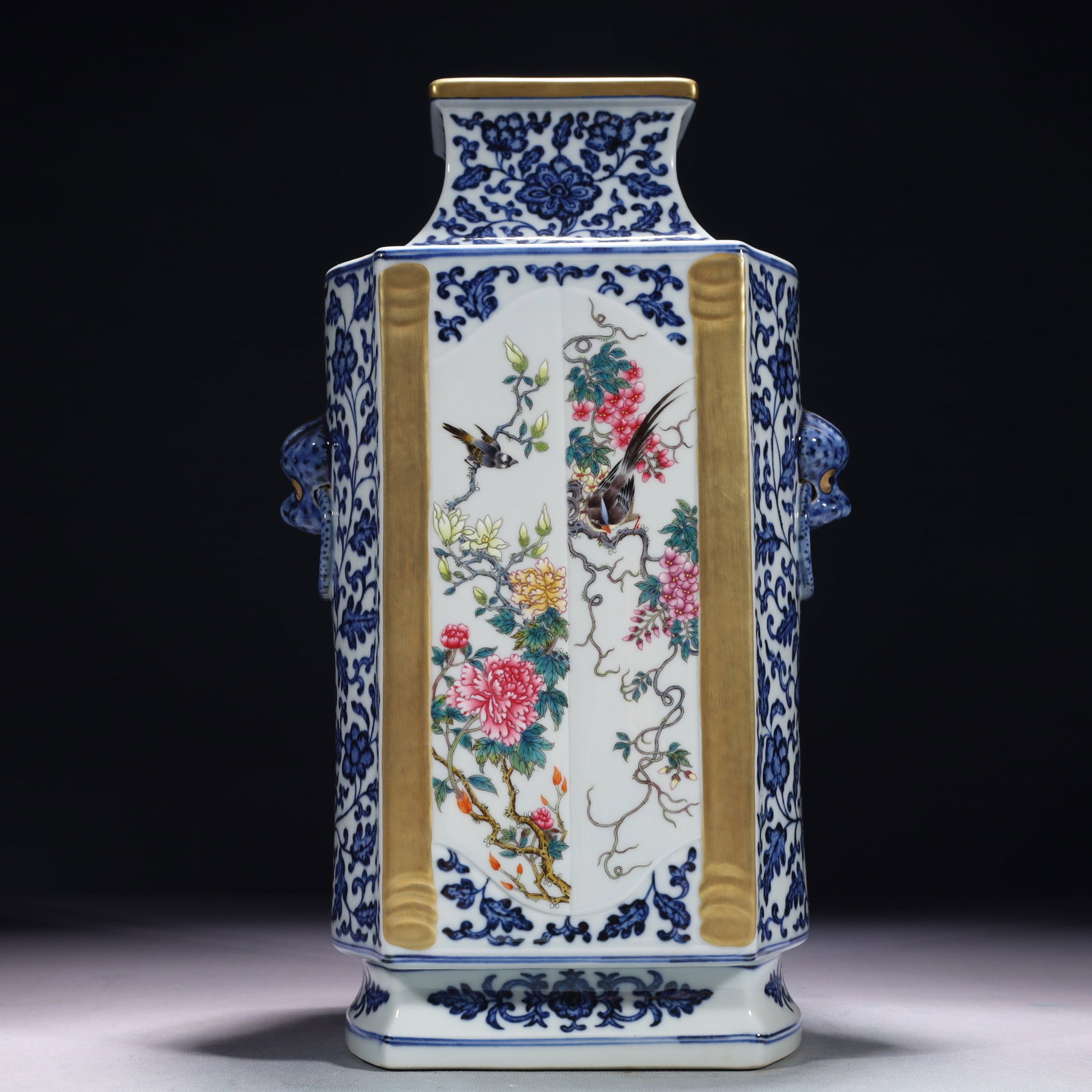 An Exquisite Blue and White Famille-Rose Painted Gold Flower and Bird Pattern Beast-Ears Vase: An Exquisite Blue and White Famille-Rose Painted Gold Flower and Bird Pattern Beast-Ears Vase,Qing Dynasty,China,Qianlong Six-character Mark,Size:7.9inx5.5inx13.4in,Weight:4250g 青花౴