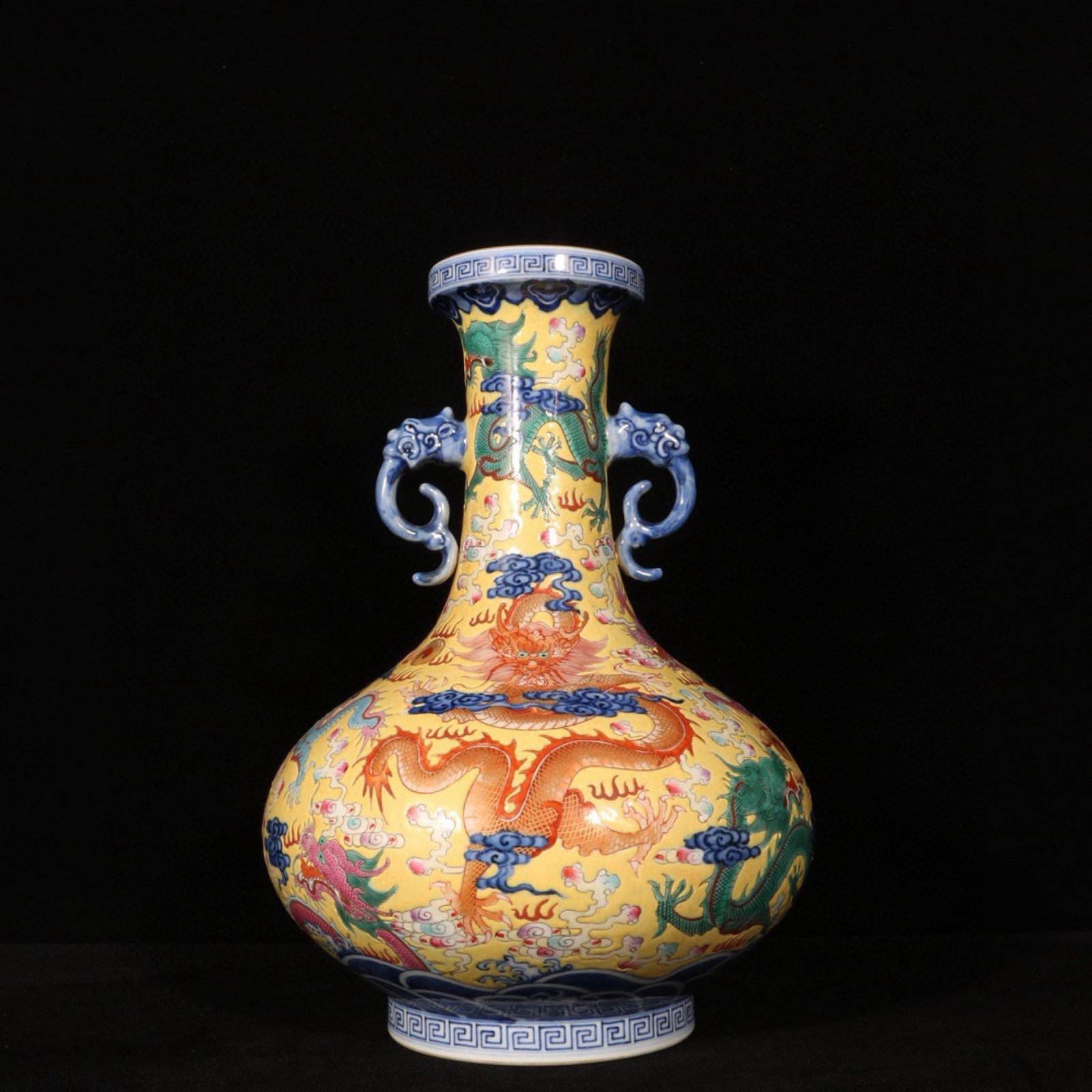 An Exquisite Yellow Ground Famille-Rose Auspicious Cloud and Dragon Pattern Double-Ears Vase: An Exquisite Yellow Ground Famille-Rose Auspicious Cloud and Dragon Pattern Double-Ears Vase,Qing Dynasty,China,Qianlong Six-character Mark,Size:11.4inx7.5in