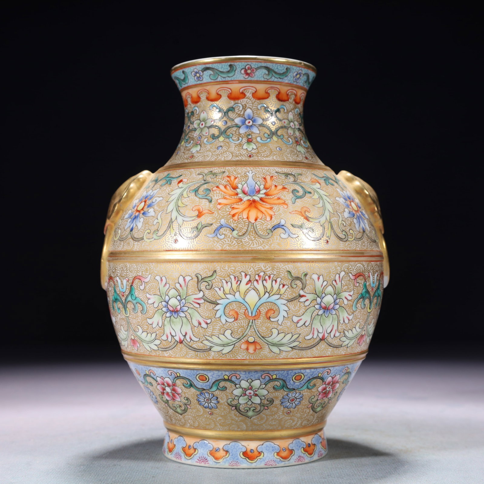 An Exquisite Famille-Rose Painted Gold Lotus Pattern Double-Ears Vase: An Exquisite Famille-Rose Painted Gold Lotus Pattern Double-Ears Vase,Qing Dynasty,China,Qianlong Four-character Mark,Size:5.5inx7.1in,Weight:600g 粉彩描金缠枝ő