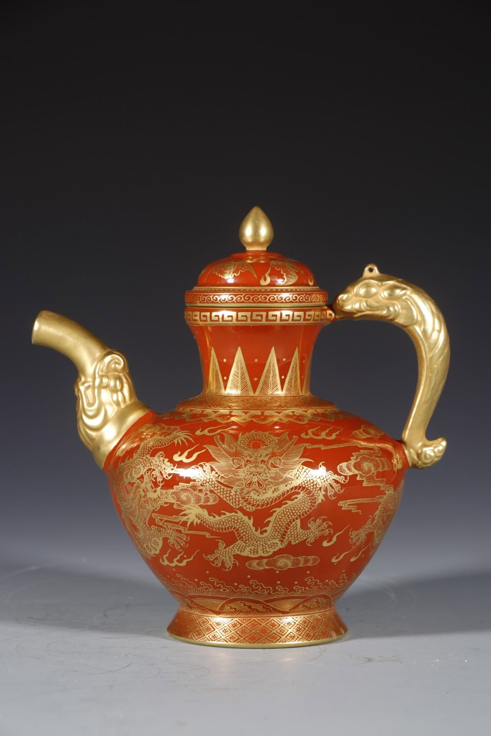An Exquisite Red Glazed Painted Gold Auspicious Cloud and Dragon Pattern Teapot: An Exquisite Red Glazed Painted Gold Auspicious Cloud and Dragon Pattern Teapot,Qing Dynasty,China,Yongzheng Four-character Mark,Size:7.5inx3.7in