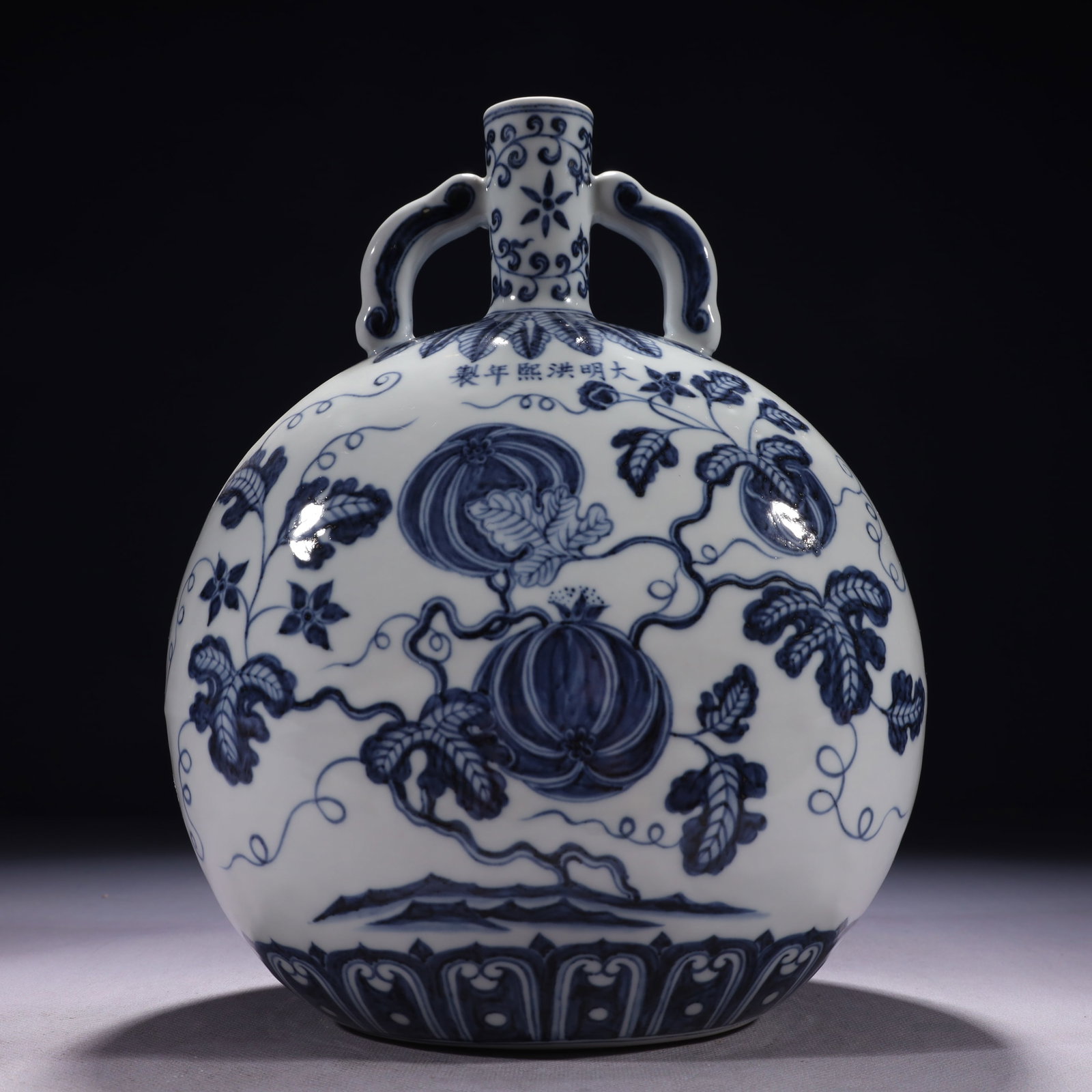 An Exquisite Blue and White Melon and Fruit Pattern Double-Ears Vase: An Exquisite Blue and White Melon and Fruit Pattern Double-Ears Vase,Ming Dynasty,China,Hongxi Six-character Mark,Size:8.3inx4.3inx11.4in,Weight:1950g
