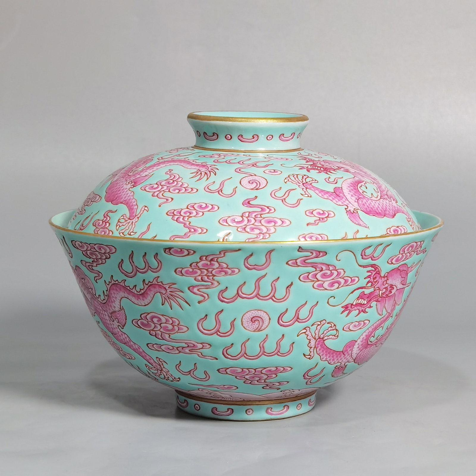 An Exquisite Turquoise Glazed Famille-Rose Painted Gold Auspicious Cloud and Dragon Pattern Bowl: An Exquisite Turquoise Glazed Famille-Rose Painted Gold Auspicious Cloud and Dragon Pattern Bowl with Cover,Qing Dynasty,China,Qianlong Six-character Mark,Size:4.6inx3.6in