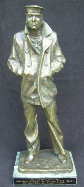Adm. Burke's Solid Bronze Statue "The Lone Sailor": Admiral Arleigh Burke's bronze presentation award copy of the Monument Statue of 'The Lone Sailor". Presented at a dinner to honor Burke in 1991. Solid Bronze statue 16.5" H. Artist: Stanley Bleifeld 