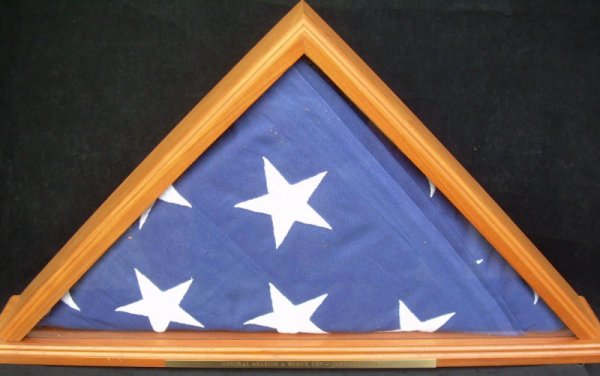 Adm. Burke's Memorial Flag, Cased: The flag that draped the coffin of Admiral Arleigh Burke along with a photograph depicting Roberta Burke, Dr. Pat Ward and President Clinton along with Naval personnel in attendance at the National Ca
