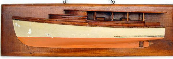 Yacht Half Model, c. 1926: Constructed of Pine and mounted on the original pine backboard. Original Surfaces. White and Salmon colored Hull with bright upperworks. Names of the owners of the yacht and or 1/2 model are written o