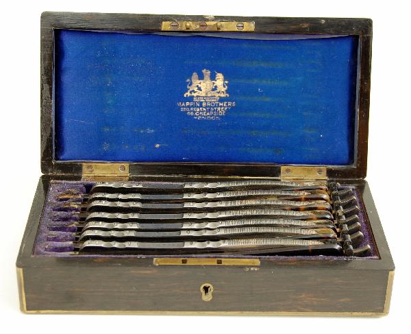 7-day Razor Set: 7-Day Razor Set by Mappin Bros., 220 Regent St. & 66 Cheapside, London. Macassar ebony box w/brass trim & inlaid escutcheon. Tortoise shell handles, all orig., one blade chipped at end. Overall excell