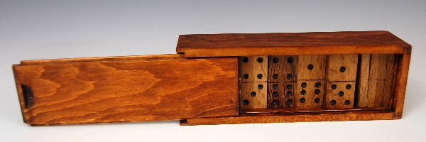 Dominoes made from C.W.Morgan oak: Set of dominoes made from original oak timber taken from the New Bedford Whaling Bark 'Charles W. Morgan'. Original box made of pine. This set is No. 2 of the 5 sets made. Condition: Excellent Size: 7