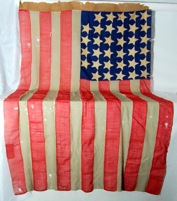34-star American Flag, 1863: 34-star American Flag, 1863 - wool bunting 34-star US national flag. The different color bunting fabrics each have a different thread count, with red being the coarsest and most open, blue being the f