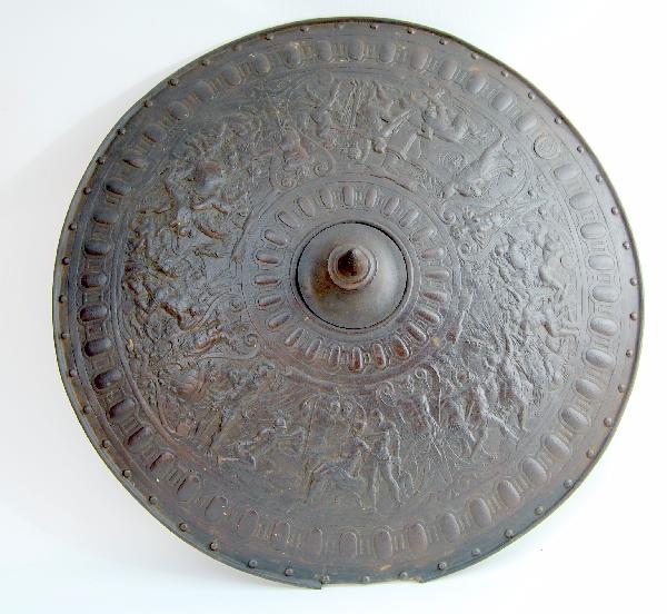 Shield-Stamped Steel w/bronze finish: Shield - 19th C. shield - Stamped Steel w/bronze finish; reverse with metal label with a crest in the center with a stag, surrounded by the words 'ILSENBUPI' (?) GRIEL SIETD (?) 21 (?); Decorated fron