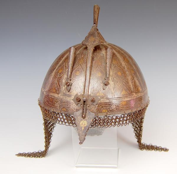 Anglo-Indian War Helmut, c. 1830: Anglo-Indian War Helmut, c. 1830 - hand-hammered steel helmut; highly decorated; sliding nose guard with lock; three plume holders; gold & silver inlays; chain maille Condition: VG Size: Height w/o ma