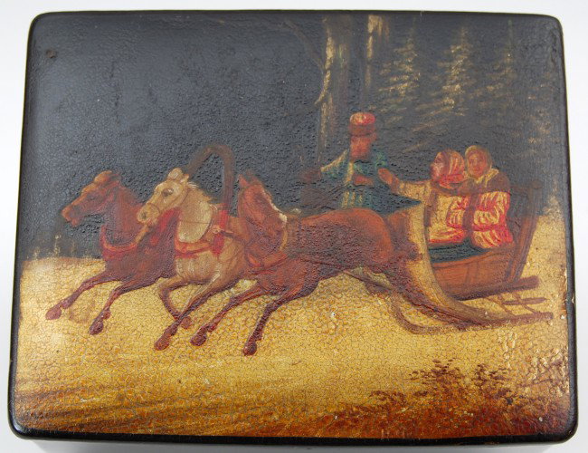 Box, Russ. Lacq. Troika, 2 women pine forest: 19th C. Russian lacquered papier mache box depicting troika with driver, sleigh carrying two women travelling through a pine forest. C. 1890 Condition: VG, craquelure to paint surface, Size: 2.75 H X 