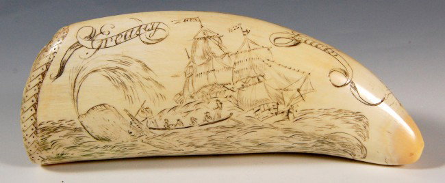 Whale tooth eng. w/ kill scene & gam: Whale's tooth engraved with a kill scene with harpooner striking from the longboat and the mother ship in the background flying a house flag with the letter N". A man watches the action from atop the 