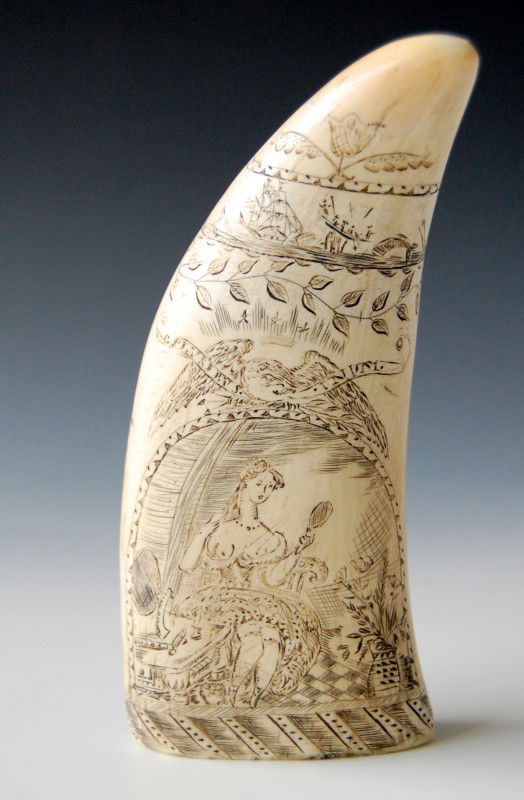Whale's Tooth-Woman With Exposed Breasts: Whale's Tooth-Woman With Exposed Breasts & Whaling scene on reverse. 19th C tooth with likely later engraving. Seated woman holding a mirror below an eagle with slogan 'E Pluribus Enum'. The opposite