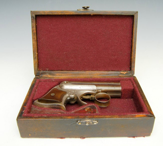Pistol, Cased Remington Derringer: Pistol, Cased Remington Derringer - marked on barrel 'Manufactured by F. Remington & Sons, Ilion, N.Y.'; Serial #3386; also marked on barrel ' Elliot S' Patents , May 29, 1860-Oct. 11 1861' engraving;