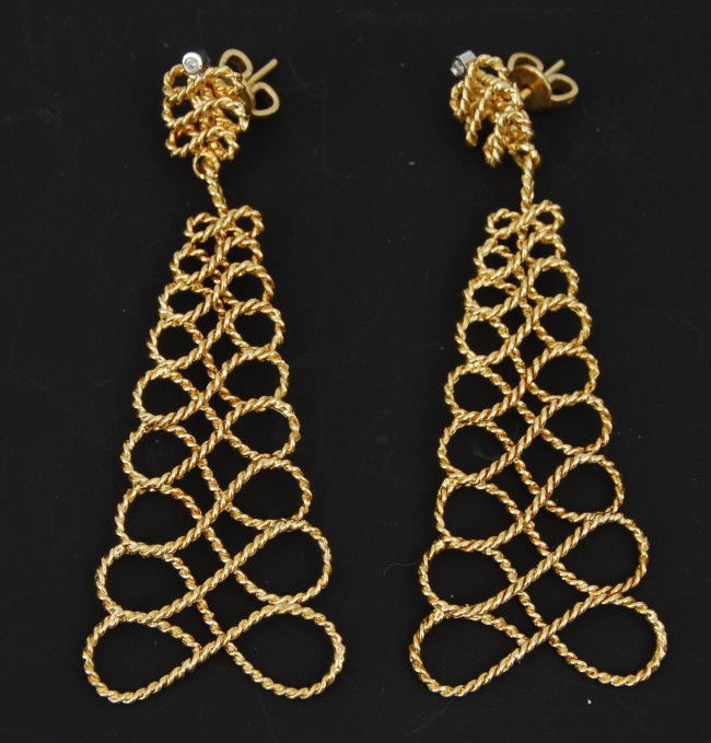 Earrings, 18 kt Roberto Coin dangles: Earrings, 18 k. Roberto Coin dangles, circa 1960-70; pyramidal figure 8 coiled wire drop & ear pc. 1 bezel-set 18 k. w.g. s.c. rd. diamond. Each ear, back of post with rose cut rd. ruby, a signature s