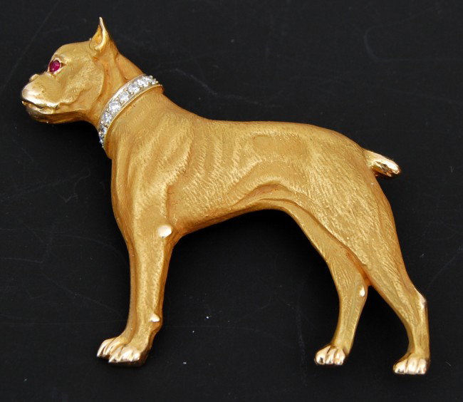 Pin-18 kt y.g. diamond & ruby Boxer: 18 kt yellow gold enamel diamond and ruby eye Boxer pin, collar set with 6 full cut rd. diamonds = .06 cttw. weight: 14 grams. Circa 1970.
