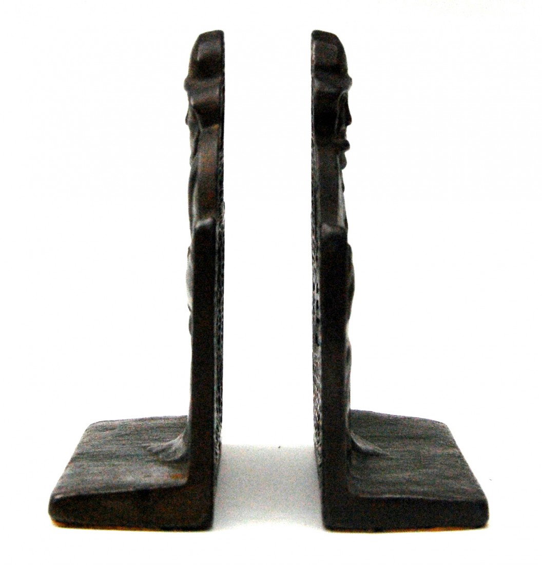 Bookends Pr, Cape Cod Fisherman Pair of cast iron : Pair of cast iron bookends with original bronze finish. Depicts the Nantucket character of Billy Baxter reading a newspaper. Stamped into the back is: 'Cape Cod Fisherman, Copyright 1928, and the Conn