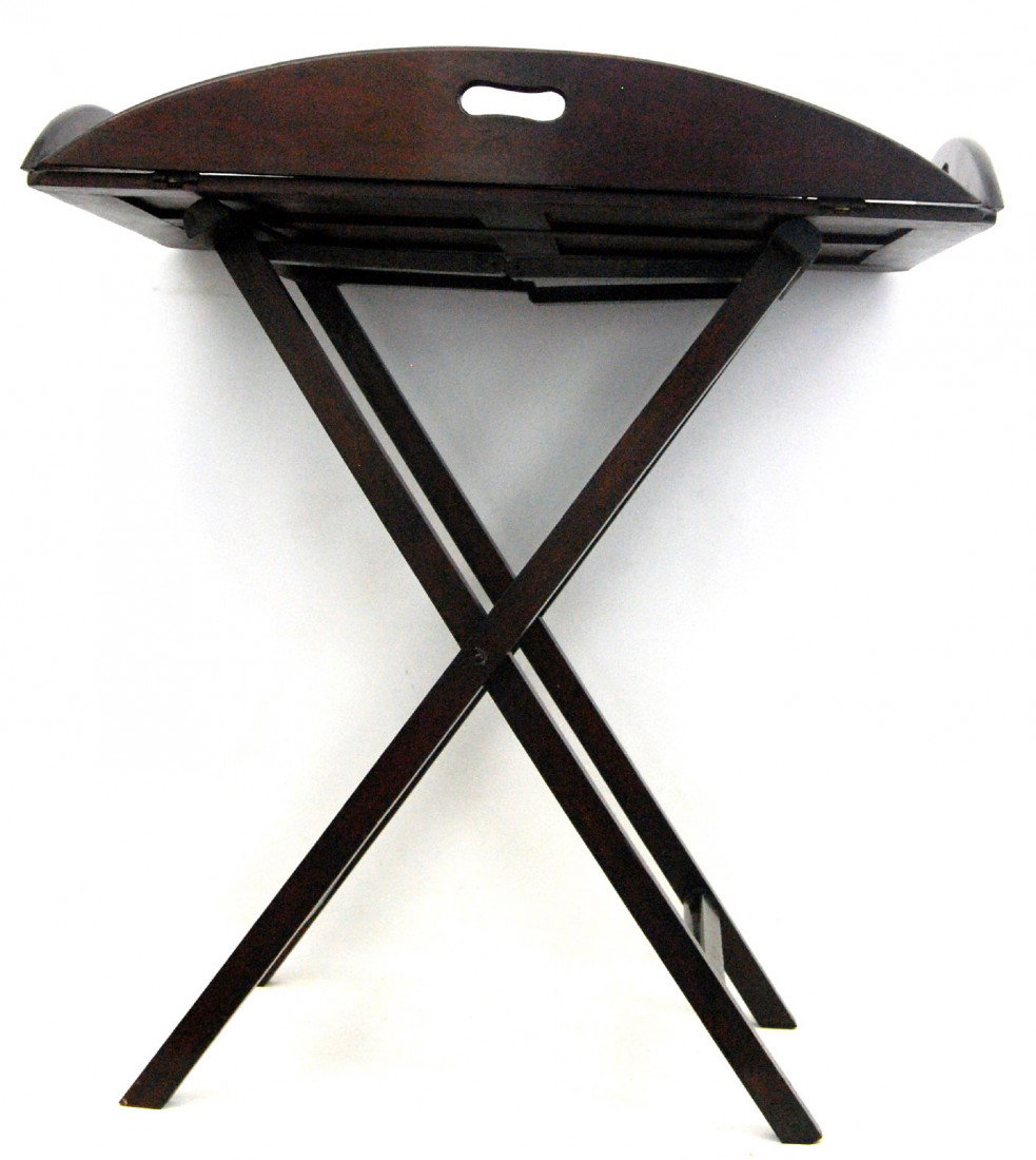 19th C Butler's Tray Table on Folding Legs: Butler's tray(removable) with a folding stand. Tray constructed of mahogany with brass inset hinges and hand hold cutouts. Folding stand also mahogany with brass hinges. British, circa 1870. Size: 33"