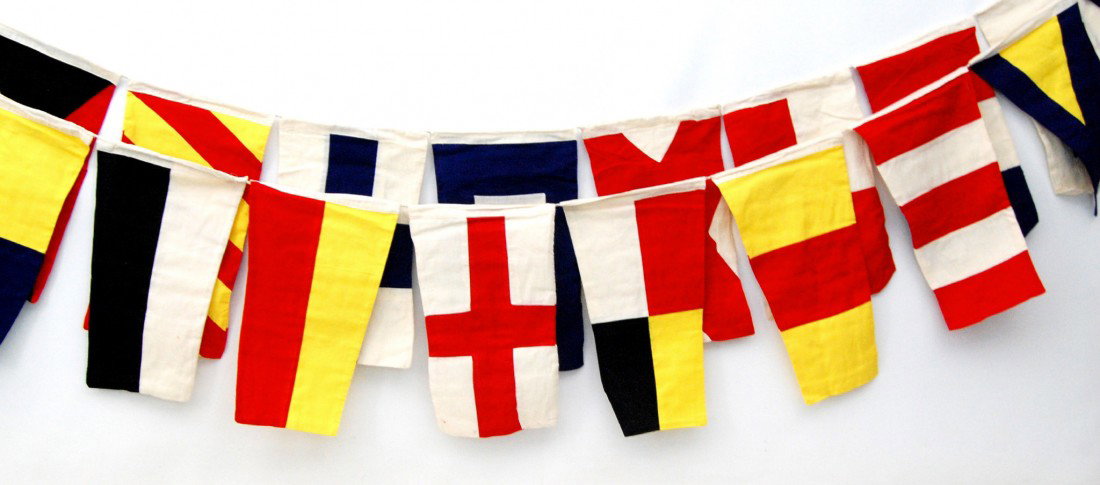 Set of Signal Flags, Cotton, 40pcs Set of strung s: Set of strung signal flags (40), mid 20th C - image shows them doubled up, but it is actually one straight 32' run (approx). Each flag connects via a cord run through the loop run along the top of the