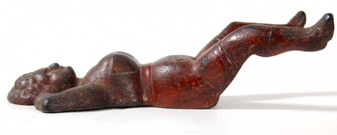 Boot Jack "Naughty Nellie", Cast Iron, 1890-1920.: Boot Jack "Naughty Nellie", Cast Iron, 1890-1920 Size: 10" H x 5" L Weight: 3lbs 2oz Condition: good, some original red coloring still visible.