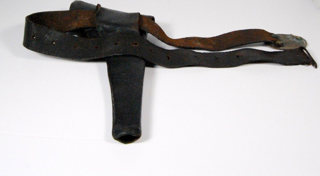 Flap holster w/belt, "U.S." Buckle Flap holster, b: Flap holster, belt and buckle for the Model 1860 army pistol. Brass rivets and flap latch. Initialed T. J. H. C. 1860 Size Belt: 44" L X 1.75" W Size Holster: 12" L X 7" W Weight: 12.1oz Condition: We