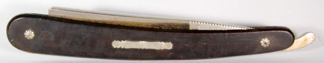 Straight Razor, Large Exhibition Size, K. Wieser A: A display razor likely used as a trade sign for a store window. Manufactured by Karl Wieser, Wien with the blade etched Hohlschleifere(Hollow Ground). The blade constructed of nickel plated brass as a
