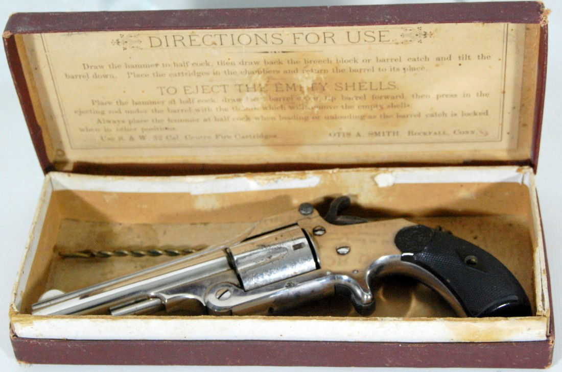Pistol, 32 cal. Model 1883 Otis A. Smith, boxed P: Pistol, 32-100 cal. by Otis A. Smith and cleaning rod. Model 1883, Shell Ejector Otis A. Smith manufactured tools and pistols in Rockfall, Ct. Maker of the famous Fales Patent combination plane he was