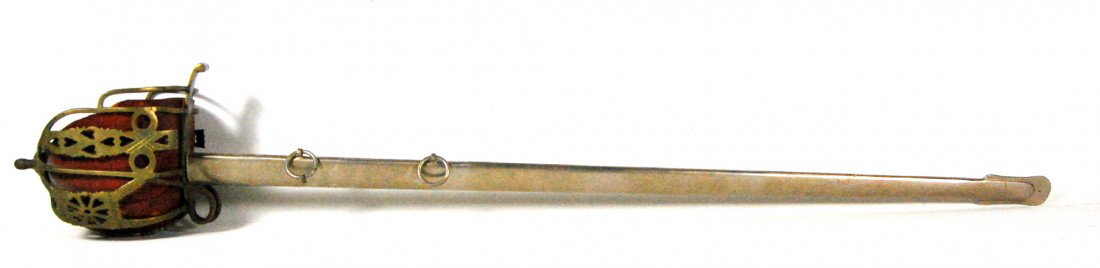Scottish Basket Hilt, Broad Sword M1831 WWI Scotti: Scottish Basket Hilt, Broad Sword model 1831 of WWI vintage. Brass hilt with heart cutouts, marked 25, original red leather liner, steel blade plated, original scabbard of plated steel with two hangar