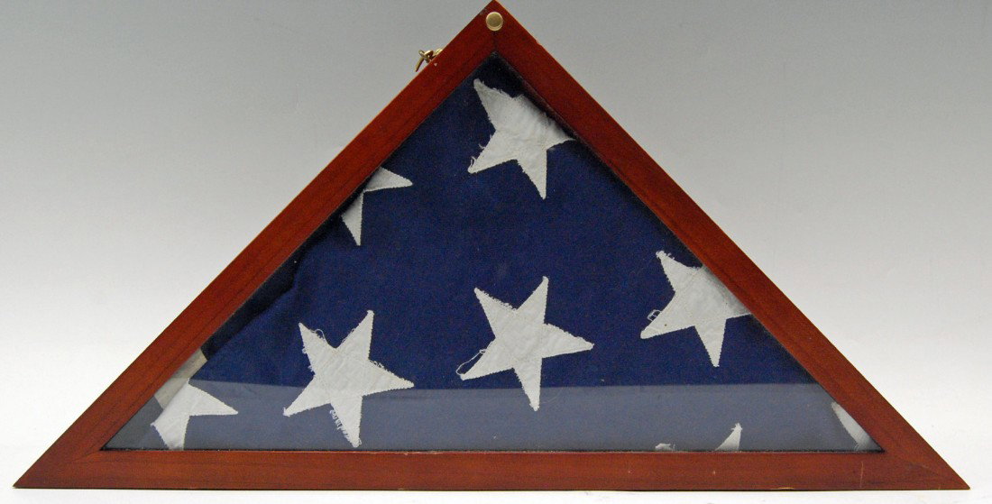 Cased Presentation American Flag, 50 stars Cased : Cased Presentation American Flag, 50 Stars - custom, triangular, hinged-door case. Size: Flag 9' H x 12' L Case: 24" x 17" x 17" x 3.5" W Weight: 5.25 lbs