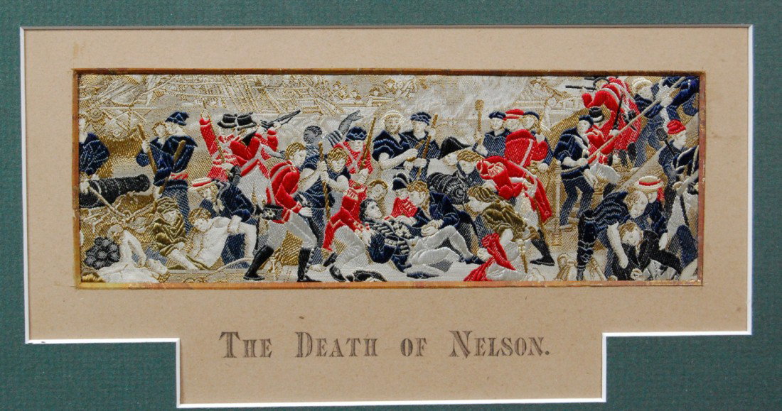 Stevengraph, "The Death of Nelson" Stevengraph de: Stevengraph depicting "The Death of Nelson" of the famed Admiral at the Battle of Trafalgar on his flag ship "Victory". Size: 8 1/2" H x 12 1/2" W Weight: 1lb 8.8oz Condition: Excellent
