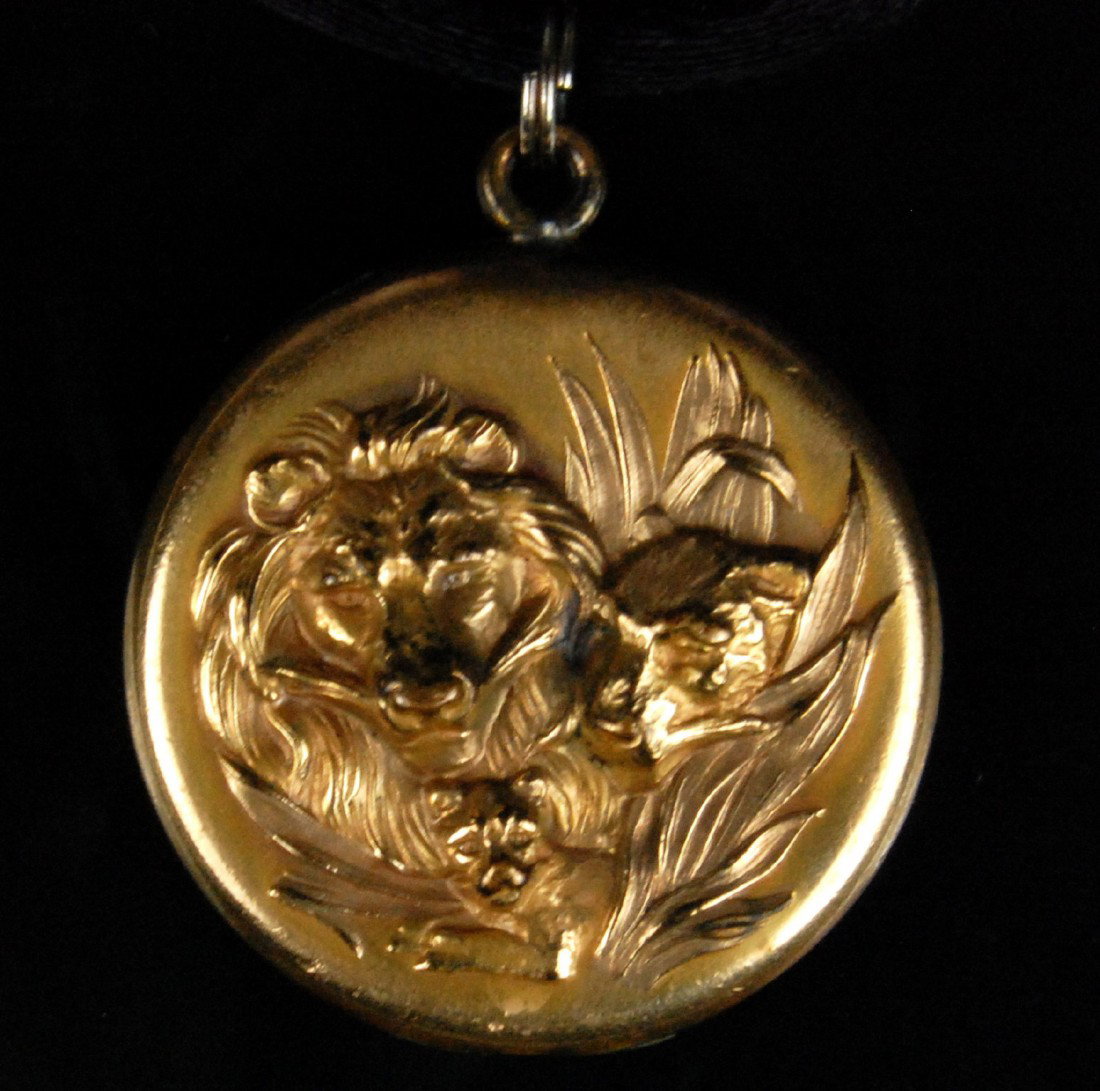 Locket, yellow gold filled Art Nouveau, Victorian: Locket - Yellow gold-filled Art Nouveau locket, lion and cub relief ornament. Initials engraved on the back of the case, "M G", for Margaret Geib, the original owner of the locket. Stamped inside the 