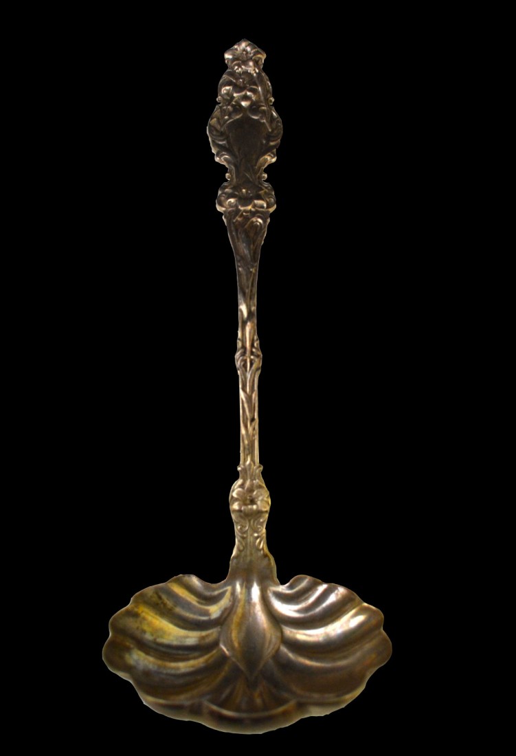 Ladle, Sterling, Day Lily pattern, circa 1890: Ladle marked sterling with day lily design on the front and back of handle. Circa 1890. Size: L. 12" x W. 4" x D. 3" Weight: 8.4oz Condition: Very good