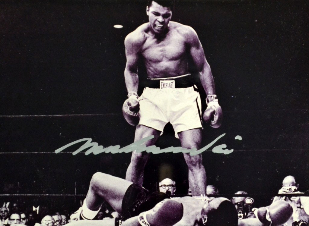 Photo-Signed Ali, Olympics Heavy Weight Gold: Photo-Signed Ali, Olympics Heavy Weight Gold. Large black & white photo of Muhammed Ali after being presented with the gold medal at the 1960 Summer Olympics. Photo is numbered 38/100, and it is authe