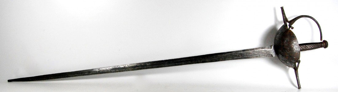 Spanish Colonial Caribbean Cup-Hilt Rapier: Spanish Colonial, Caribbean cup, wrought hilt and blade having double edge and three fullers. The bowl edge lightly decorated with a single line is hand welded to the straight cruciform having bud end