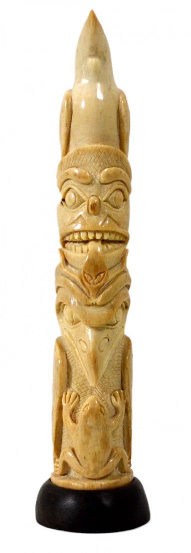 Totem Pole carving of Walrus Oosik by Haida People: Totem Pole of Walrus Oosik (Penis) -- NW Coastal carving, typical of Haida. Contemporary carving attached to a wooden base. Size, including base: 6.5" L X 1.75" diameter Weight: 5oz Condition: Excelle