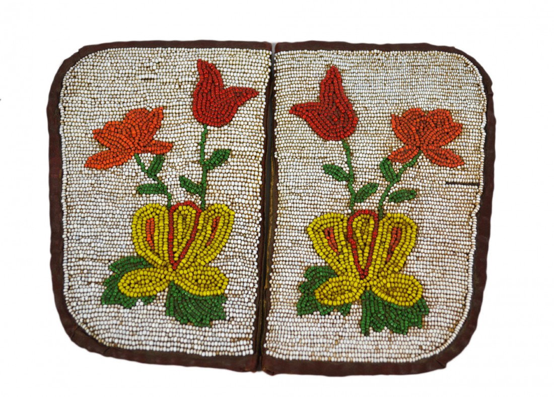 Indian Beaded Floral Pattern Dance Leggings 19thC: Native American Indian Beaded Floral Pattern Dance Leggings 19th Century, with brown leather backing. Provenance: Miki and James J. Mangan III of Fairfield, CT Size: L. 7.5" x W. 5" Weight: 9.5oz Cond