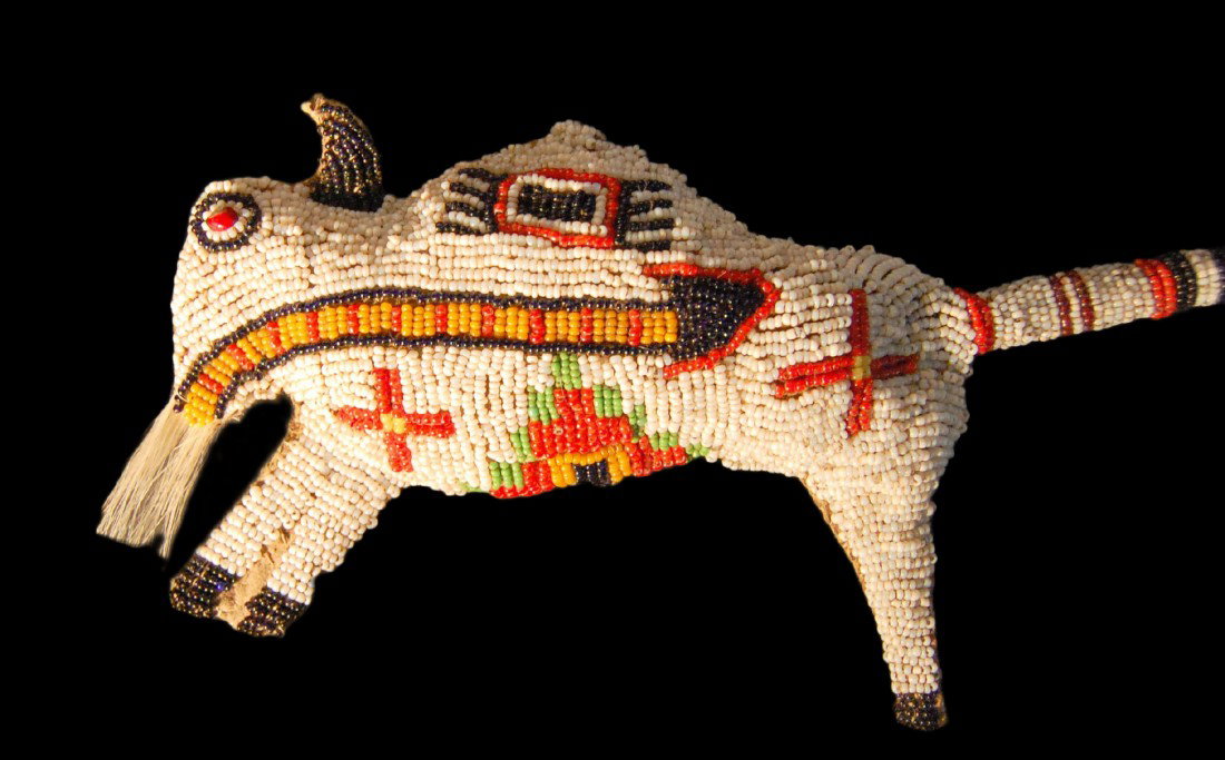 Fetish Buffalo Skin & Bead Work, Plains: Fetish Buffalo Skin & Bead Work, Plains Indian, Circa 1885. Horse hair tail, and white hair accents upon face of buffalo. Very good and colorful beadwork. Provenance: Miki and James J. Mangan III of F