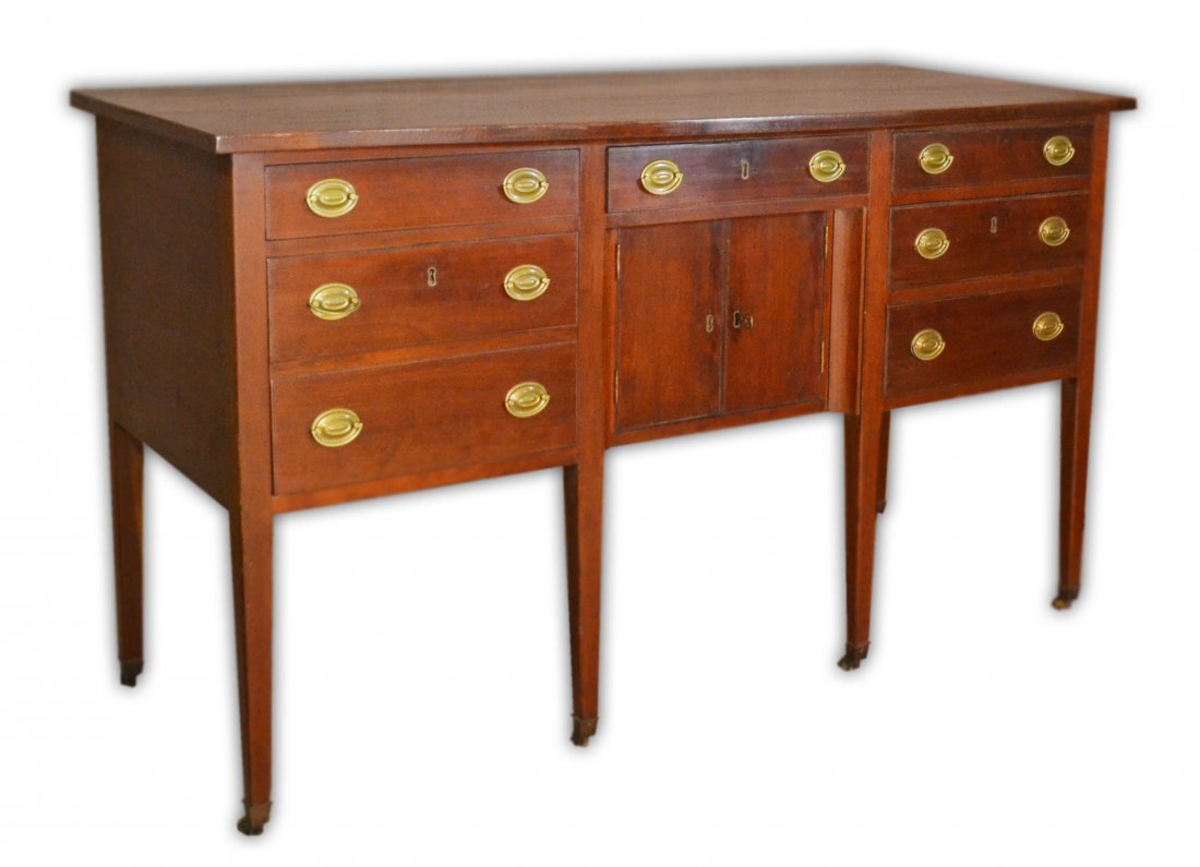Federal Sideboard, Serpentine, c. 1800-1810: An American Federal period sideboard with serpentine front and top. Made between 1800-1810 of cherry wood in Connecticut or upstate New York. Size: 38.25" H x 64" W x 28.25" D Weight: approx 125lbs