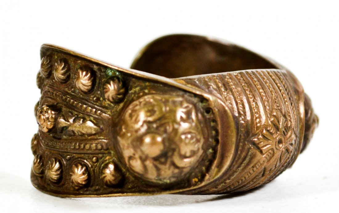 Bracelet, Bronze, Hunnic, 17th c. or earlier: This Hunnic bronze bracelet is from the Crimea peninsula where Attila had his capital city in the 6th century prior to invading Western Europe. It is decorated symmetrically with two round protruding