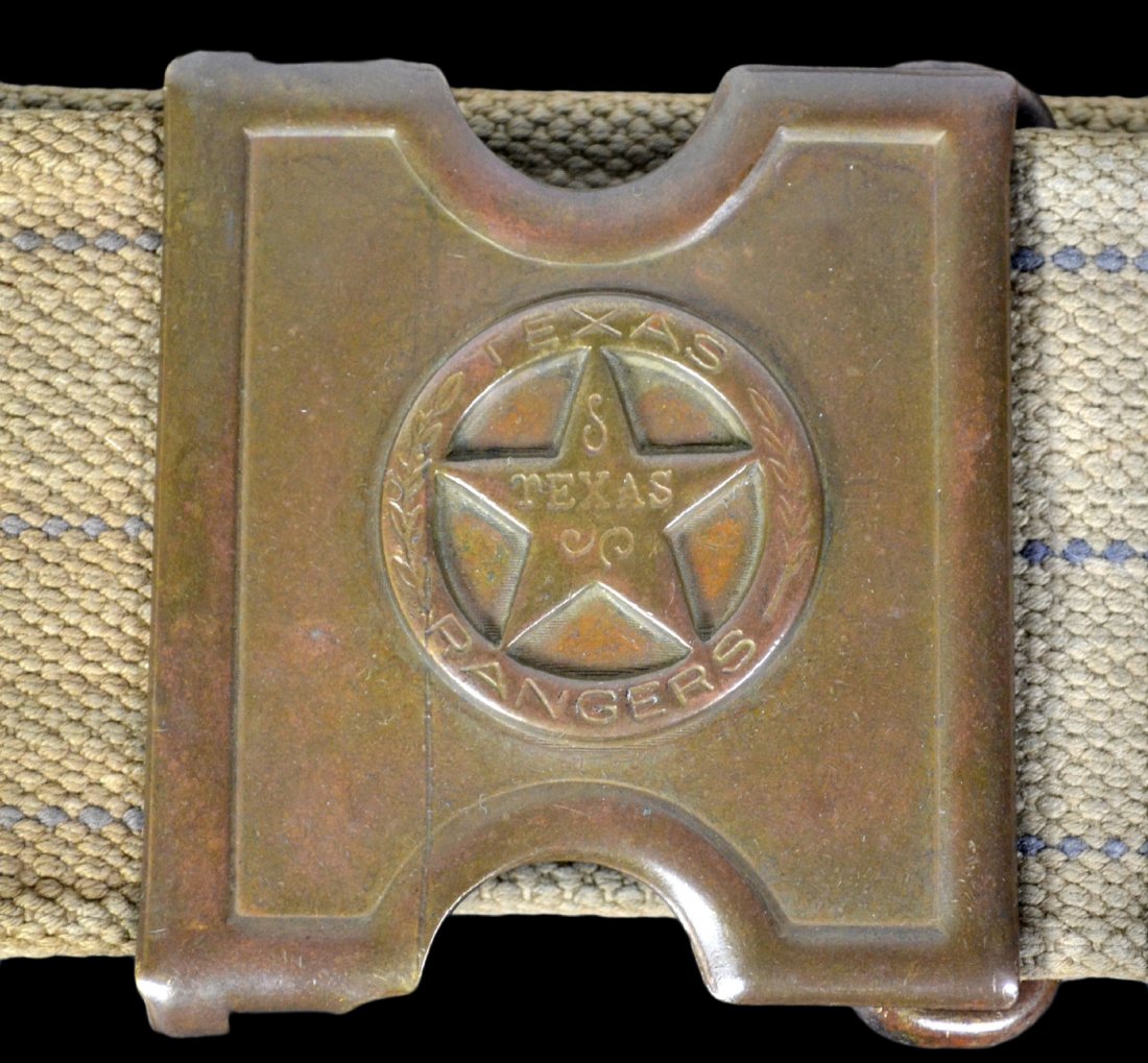 Ranger belt, Pat. 1881, Mills Texas Ranger: A marked Texas Ranger cartridge belt. A white canvas belt with brass fittings and keepers. The front of the buckle has the classic lone star badge design, the buckle hook reads, "ANSON MILLS, PAT. FEB