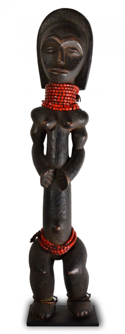 Portrait carving maternal figure of the Dan tribe: Portrait wood carving of a maternal figure of the Dan tribe with glass beads. Copper anklets are a later addition. Size: 19.5" H. including custom stand Weight: 2.65lbs *******************************