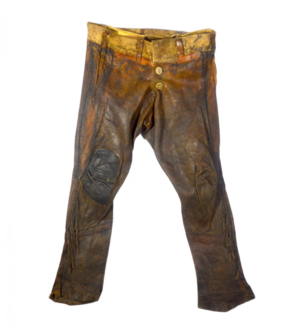 Pants, Mountain Man, tanned hide w/horn, 19th C.: 19th century "Mountain man" pants. Made from tanned hide. They still bear their original fringe, and sewn together with leather, hair and sinew. They button in the front with bone or horn buttons. The