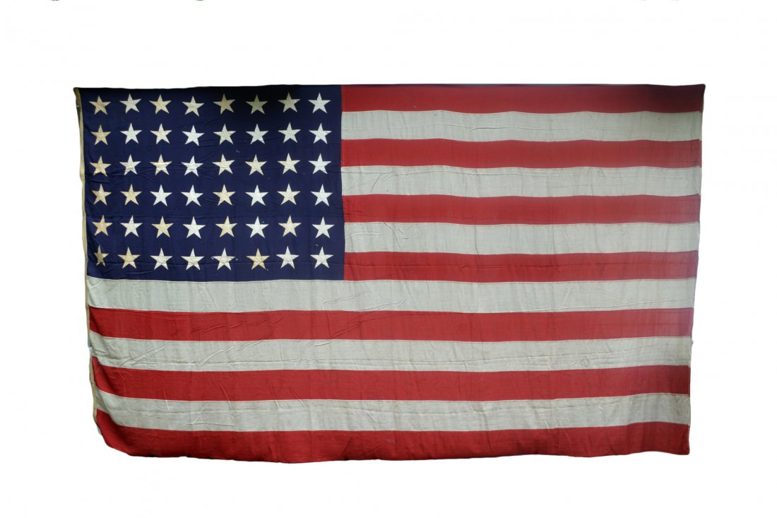 Flag, 48-star American, wool, 106" x 15'9": Flag, 48-star American, wool, marked No. 6. Maker Dollin (?) Flag Co., Inc. Appliqued stars and sewn stripes. Provenance: Mariner's Museum, Newport News, VA. Size: 106" hoist x 15' 9" L Weight: 7lbs