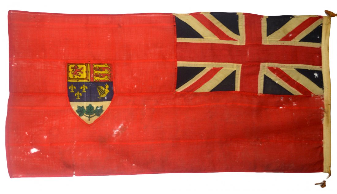 Flag, Canadian Red Ensign, 28"x57": Flag, Canadian Red Ensign (1921-1957) - maker unknown. Wool with appliqued work, likely post WWII. The Canadian Red Ensign. This design (green leaves in the coat of arms) was used from 1957 until 1965