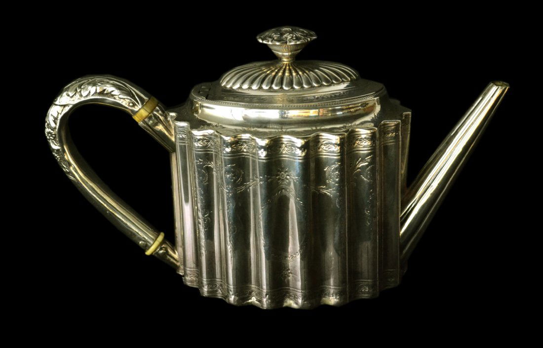 Teapot, Sterling, Hester Bateman, mark 1787: Teapot, Sterling, Hester Bateman, mark 1787 Form: Teapot Makers Mark: HB Country of Origin: Great Britain Other Marks Lion passant, duty, town, date letter Decoration: Repousse chased teapot, vertical