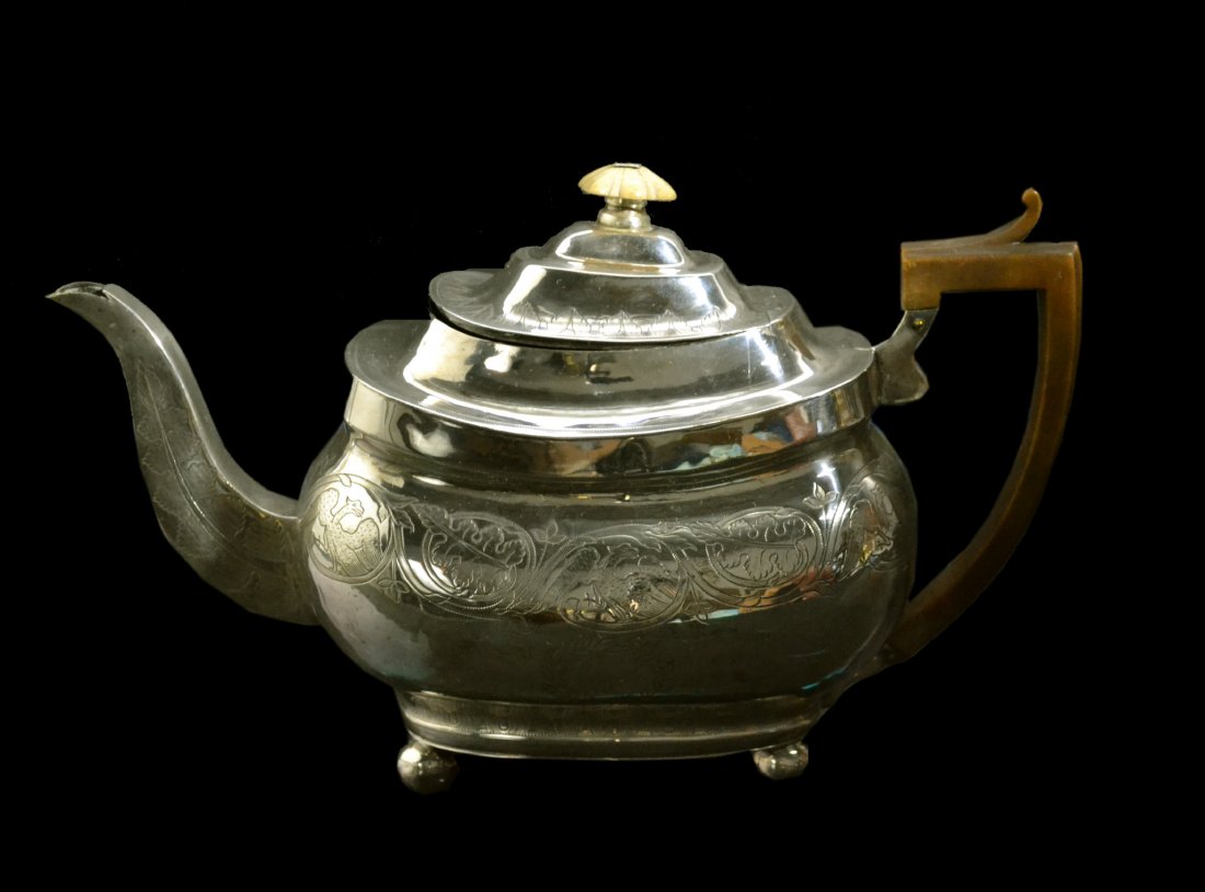 Teapot, Silver, Regency, London, 1810, 16.5 oz.: Teapot, Silver, Regency, London, 1810 Form: Teapot Makers Mark: Unreadable Country of Origin: Great Britain Other Marks Lion passant, date, duty & town mark Decoration: Zipper engraved outlines of all