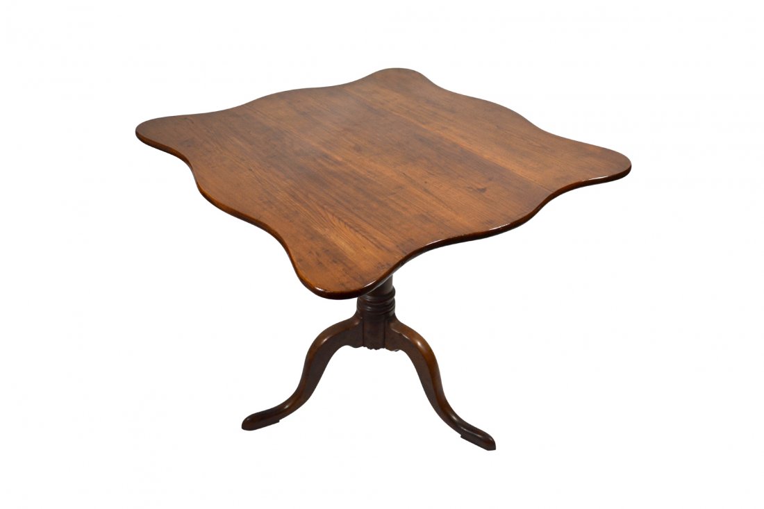 Table, tilt top, New England, c. 1795: Table, tilt top, New England, c. 1795 Table, Tilt Top Wood: Cherry Secondary Wood: Cherry Joinery: Dovetailed Features: Carved legs, dovetailed into the posts; post is lathe turned with scribe lines a