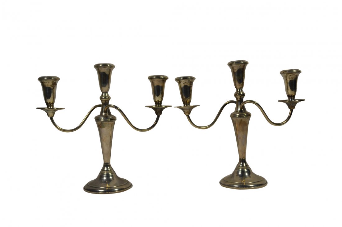 Candelabra, Pair, Sterling, 20th Century: Candelabra, Pair, Sterling, 20th Century Pair of candelabras Material: Silver Construction: Cast, plaster filled Features: Base is marked 'Empire Sterling Weighted 676'. Three pieces screw together. P