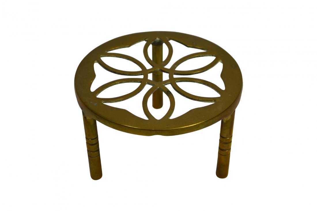 Trivet, Brass, Mid 19th Century: Trivet, Brass, Mid 19th Century Trivet Material: Brass Construction: Cast Period: Mid 19th century Size: 3" H x 5" Diameter Weight: 10oz Condition: Very good. Provenance: The estate of Arthur J. Conno