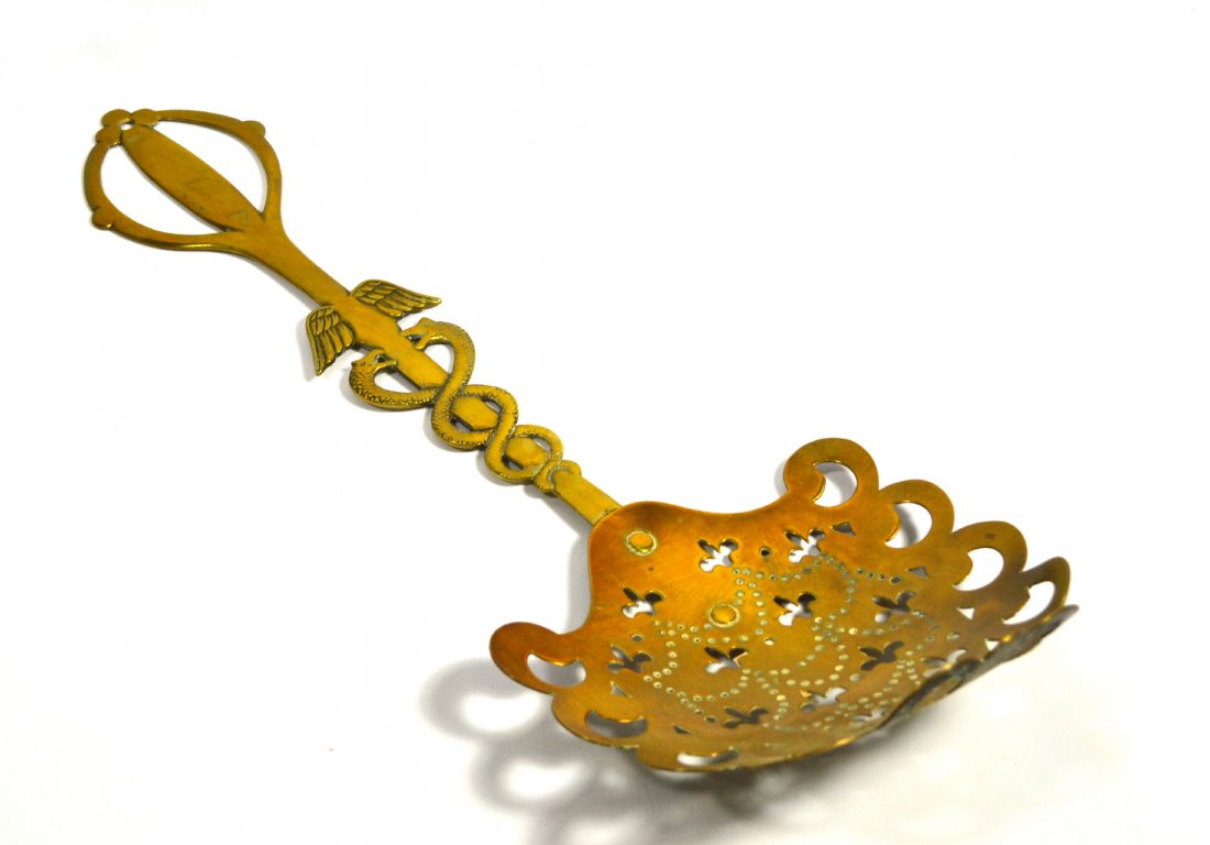 Skimmer, Brass, Medical Design, Circa 1840: Skimmer, Brass, Medical Design, Circa 1840 Skimmer Material: Brass Construction: Riveted to handle Features: Dished scoop. The handle fashioned as a caduceus with the wings of Mercury and the entwined